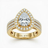 Yellow Gold Pear Cut Double Halo Engagement Ring With Four Prong Setting And Diamond Pavé Split Band