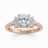 Rose Gold Cushion Cut Engagement Ring With Marquise Diamond Floral Side Clusters And Pavé Band