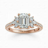 Rose Gold Emerald Cut Engagement Ring With Marquise Diamond Floral Side Clusters And Pavé Band