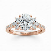 Rose Gold Oval Cut Engagement Ring With Marquise Diamond Floral Side Clusters And Pavé Band