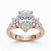 Rose Gold Pear Cut Engagement Ring With Floral Diamond Cluster Sides And Pavé Band
