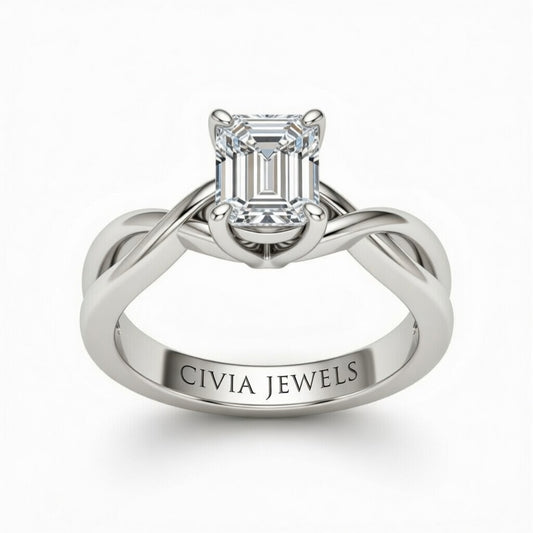 White Gold Emerald Diamond Solitaire Engagement Ring With Interwoven Twist Shank