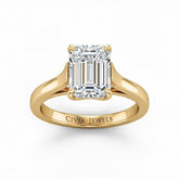 Yellow Gold Emerald Cut Solitaire Engagement Ring with Sleek Tapered Shank