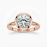 Rose Gold Round Cut Bezel Set Solitaire Engagement Ring with Polished Comfort Fit Band
