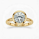 Yellow Gold Round Cut Bezel Set Solitaire Engagement Ring with Polished Comfort Fit Band