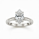 White Gold Marquise Cut Solitaire Engagement Ring with Sculpted Tapered Shank