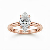 Rose Gold Marquise Cut Solitaire Engagement Ring with Sculpted Tapered Shank