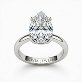 White Gold Pear Cut Solitaire Engagement Ring with Sculpted Tapered Shank