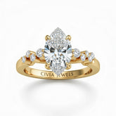 Yellow Gold Marquise Cut Engagement Ring With Diamond Scatter Accent Shoulders And Classic Four-Prong Setting