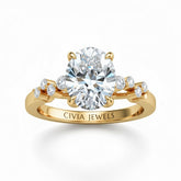Yellow Gold Oval Cut Engagement Ring With Diamond Scatter Accent Shoulders And Classic Four-Prong Setting
