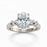 White Gold Oval Cut Engagement Ring With Diamond Scatter Accent Shoulders And Classic Four-Prong Setting