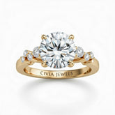 Yellow Gold Round Cut Engagement Ring With Diamond Scatter Accent Shoulders And Classic Four-Prong Setting