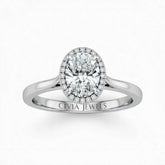 Silver Oval Cut Halo Engagement Ring With Classic Four Prong Setting And Slim Band