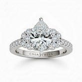 Silver Pear Cut Engagement Ring With Diamond Cluster Side Accents And Pavé Band