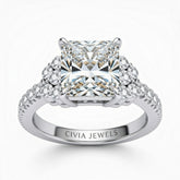 Silver Princess Cut Engagement Ring With Diamond Cluster Side Accents And Pavé Band