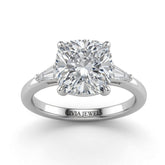 Silver Cushion Cut Three Stone Engagement Ring With Tapered Baguette Side Diamonds And Classic Four Prong Setting