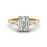 Yellow Gold Emerald Cut Three Stone Engagement Ring With Tapered Baguette Side Diamonds And Classic Four Prong Setting