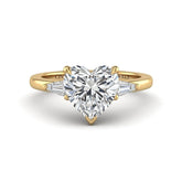 Yellow Gold Heart Cut Three Stone Engagement Ring With Tapered Baguette Side Diamonds And Classic Four Prong Setting