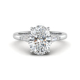 White Gold Oval Cut Three Stone Engagement Ring With Tapered Baguette Side Diamonds And Classic Four Prong Setting