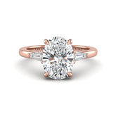 Rose Gold Oval Cut Three Stone Engagement Ring With Tapered Baguette Side Diamonds And Classic Four Prong Setting