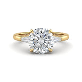 Yellow Gold Round Cut Three Stone Engagement Ring With Tapered Baguette Side Diamonds And Classic Four Prong Setting
