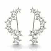 White gold Star Cluster Diamond Crescent Earrings with Round Cut Stones on a Curved Band and Prong Setting