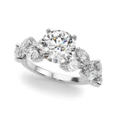 White gold Round Brilliant Diamond Solitaire with Marquise and Pear Accent Stones on a Split Shank Band with Four-Prong Setting