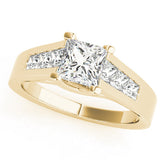 Yellow gold Pear Cut Channel Set Solitaire Ring with Four-Prong Setting