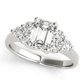 White gold Emerald Cut Diamond Cluster Ring with Round Accent Stones and Prong Setting on a Classic Band