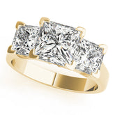Yellow gold Three-Stone Princess Cut Diamond Ring with Channel Set Band and Four-Prong Setting