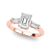 Rose gold Emerald Cut Diamond Ring with Tapered Baguette Side Stones on a Platinum Band with Four-Prong Setting