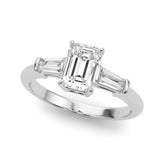 White gold Oval Cut Diamond Ring with Tapered Baguette Side Stones on a Platinum Band with Four-Prong Setting