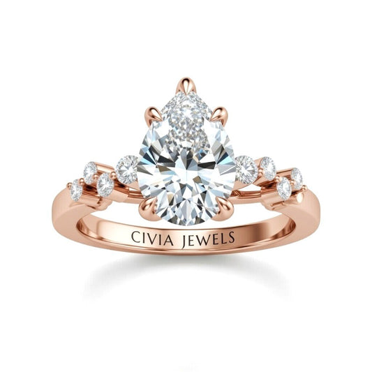 Rose Gold Pear Cut Engagement Ring With Diamond Scatter Accent Shoulders And Classic Four-Prong Setting