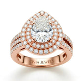 Rose Gold Pear Cut Double Halo Engagement Ring With Four Prong Setting And Diamond Pavé Split Band