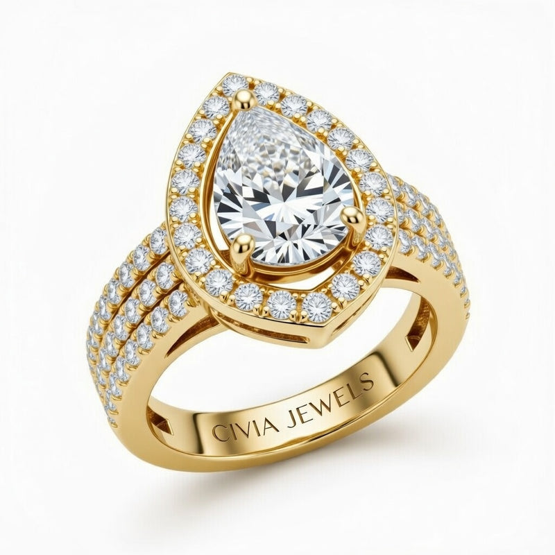 Yellow Gold Pear Cut Double Halo Engagement Ring With Four Prong Setting And Diamond Pavé Split Band