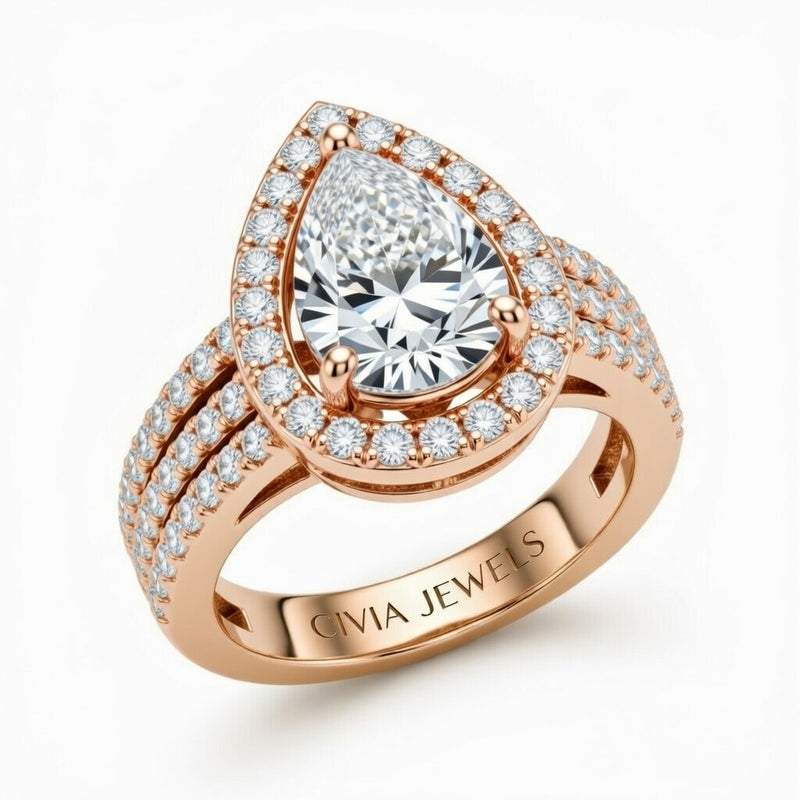 Rose Gold Pear Cut Double Halo Engagement Ring With Four Prong Setting And Diamond Pavé Split Band