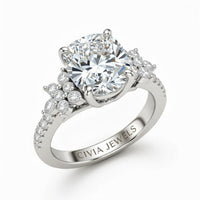 White Gold Cushion Cut Engagement Ring With Floral Diamond Cluster Sides And Pavé Band