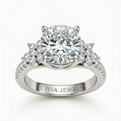 White Gold Cushion Cut Engagement Ring With Floral Diamond Cluster Sides And Pavé Band