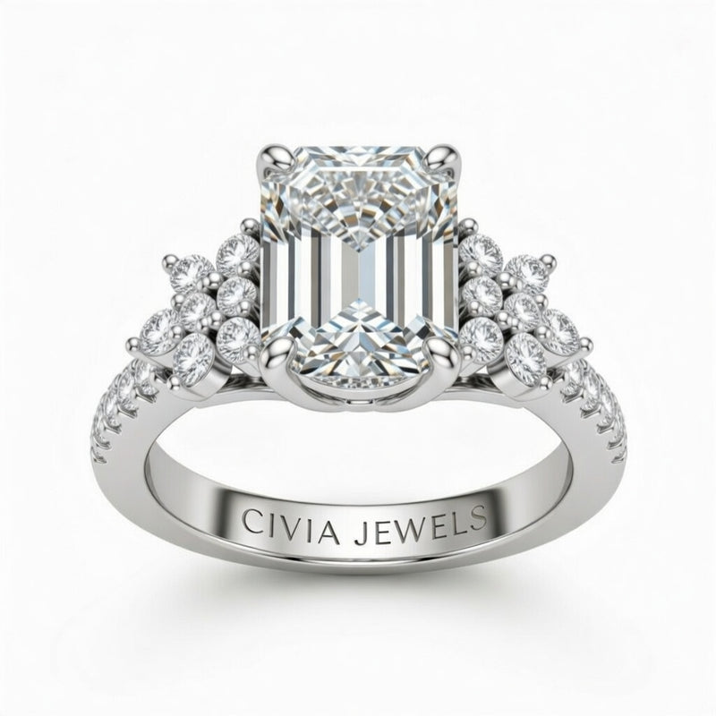 White Gold Emerald Cut Engagement Ring With Floral Diamond Cluster Sides And Pavé Band