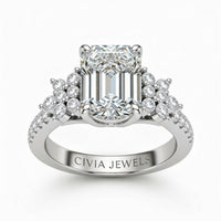 Silver Emerald Cut Engagement Ring With Floral Diamond Cluster Sides And Pavé Band