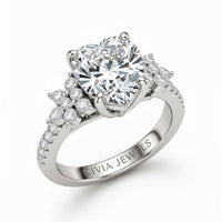 White Gold Heart Cut Engagement Ring With Floral Diamond Cluster Sides And Pavé Band