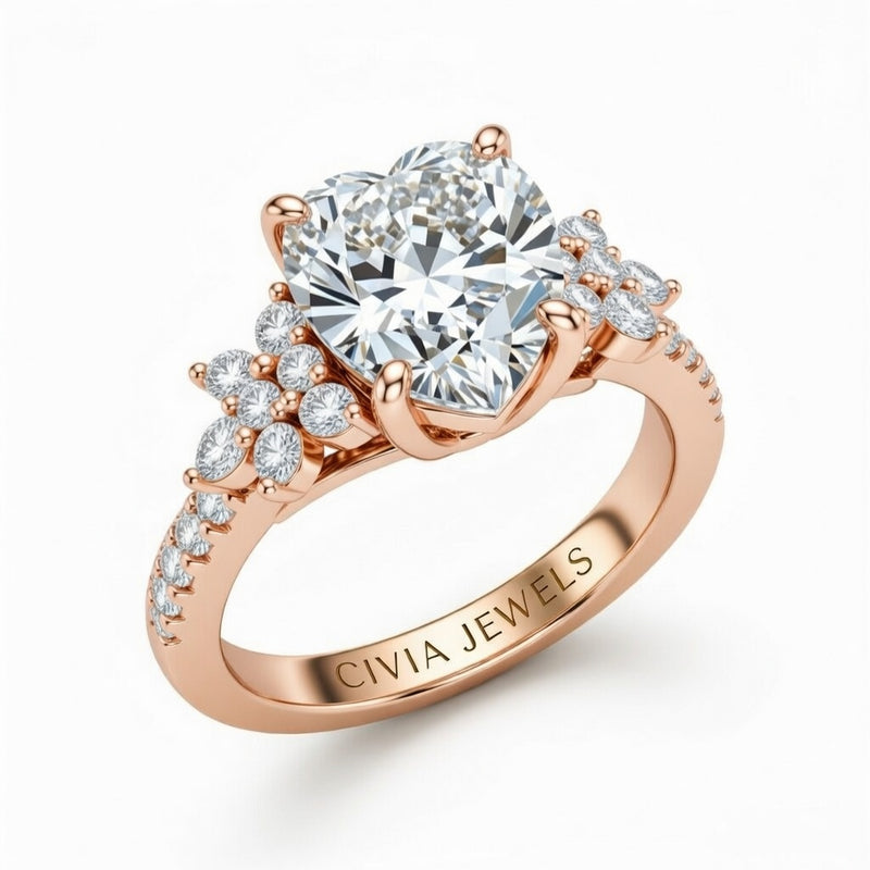 Rose Gold Heart Cut Engagement Ring With Floral Diamond Cluster Sides And Pavé Band