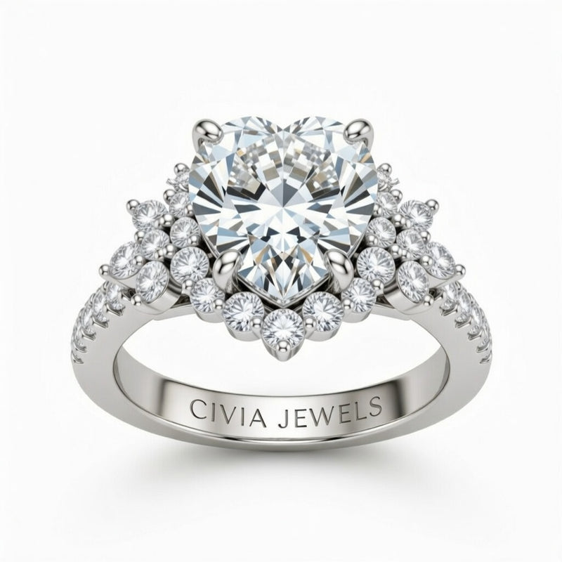 White Gold Heart Cut Engagement Ring With Floral Diamond Cluster Sides And Pavé Band