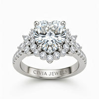 White Gold Heart Cut Engagement Ring With Floral Diamond Cluster Sides And Pavé Band