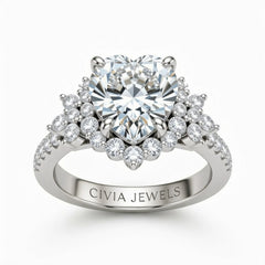 White Gold Heart Cut Engagement Ring With Floral Diamond Cluster Sides And Pavé Band