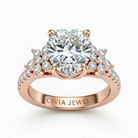 Rose Gold Heart Cut Engagement Ring With Floral Diamond Cluster Sides And Pavé Band