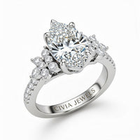 White Gold Marquise Cut Engagement Ring With Floral Diamond Cluster Sides And Pavé Band