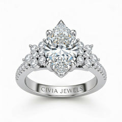 White Gold Marquise Cut Engagement Ring With Floral Diamond Cluster Sides And Pavé Band