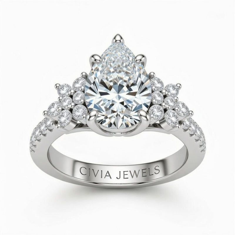Silver Pear Cut Engagement Ring With Floral Diamond Cluster Sides And Pavé Band