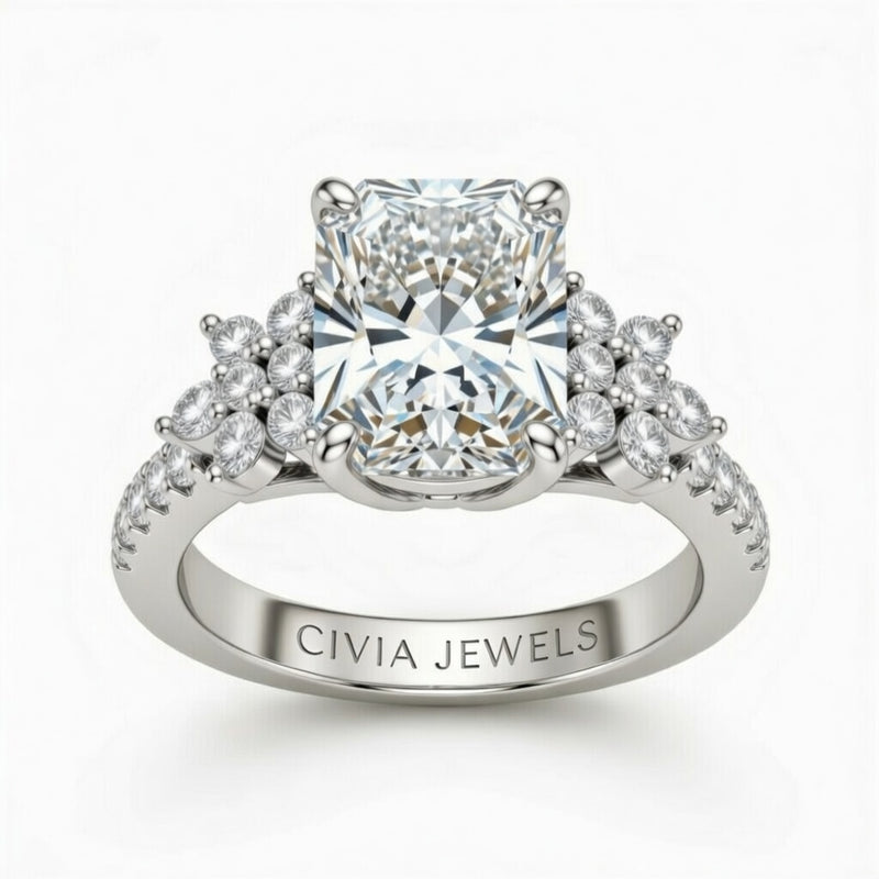 White Gold Radiant Cut Engagement Ring With Floral Diamond Cluster Sides And Pavé Band